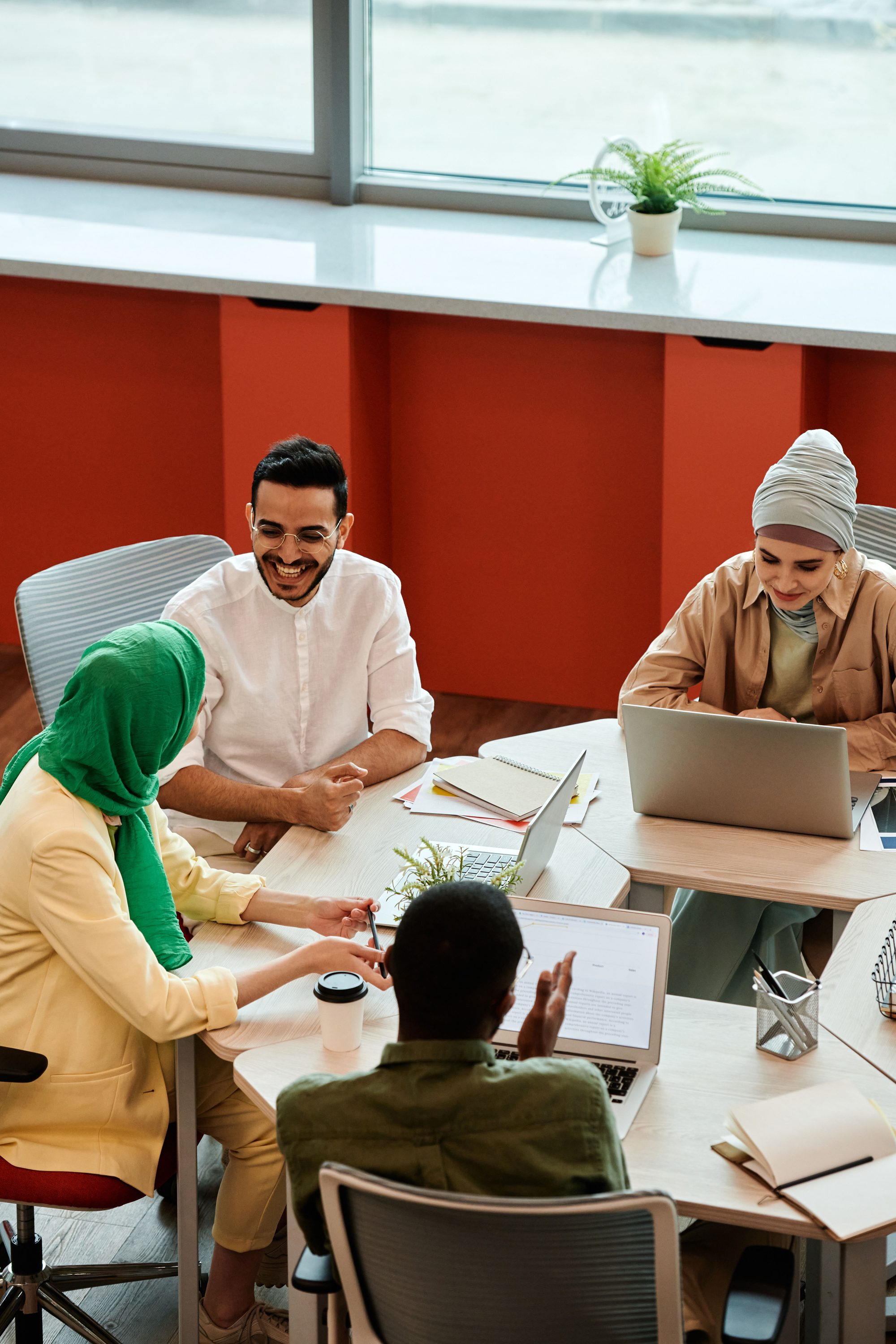 A diverse team collaborating around a table